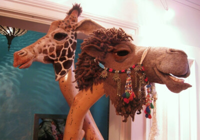 Needle felted giraffe and camel masks by Stefanie Buss.