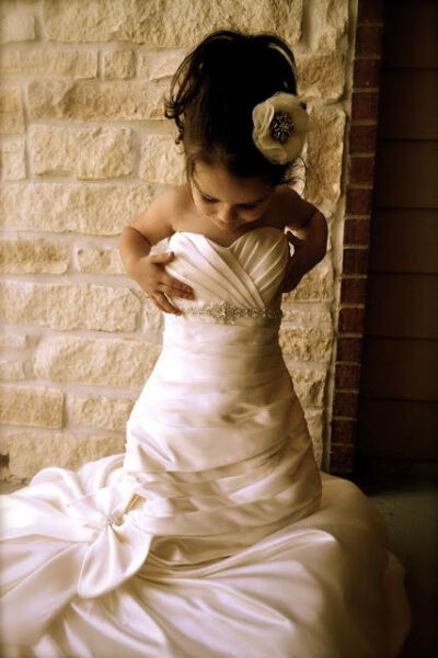 Take a picture of your daughter in your dress &amp;amp; hide it until her wedding day then give it to her!
