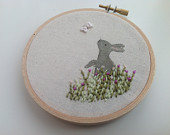 Hare hoop art. Painted fabric and embroidery picture. Handmade in the UK