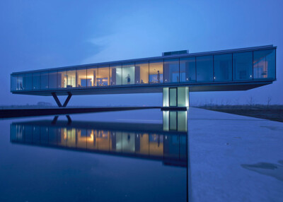 Ecological house with a glass box above the landscape