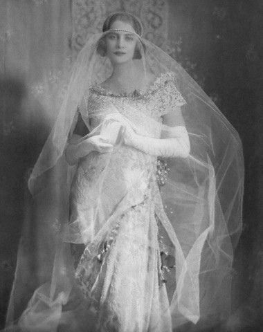 Wedding gown with a pearl and tulle veil