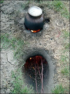 Cooking over a Dakota Fire Hole... saves wood and does not smoke...