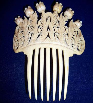 Victorian ivory comb decorated with lilies of the valley. c. 1880.