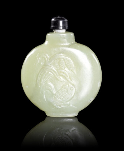 A Jade Snuff Bottle, of a pale celadon hue and of compressed globular form, having relief carving of a bird below a leafy plant, on a recessed foot.
