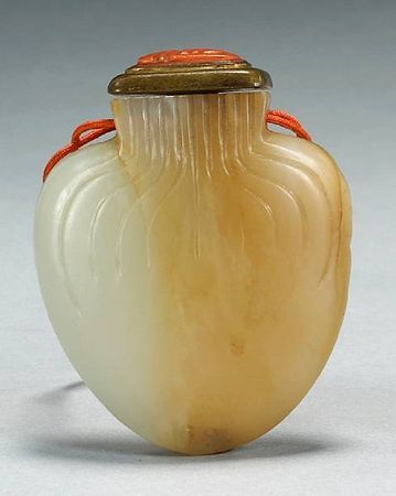 Property from the Estate of Gardner Hart Pierson. A jade purse-form snuff bottle, 1820-1900. Taking the shape of a traditional Chinese hebao the stone with white and russet coloration, with a flat rectangular mouth rim, the neck and shoulders incised with lines imitating the folded fabric, the neck