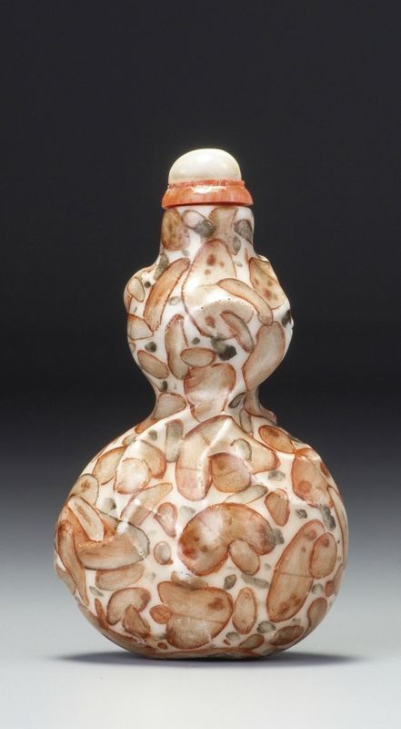 An Imperial moulded porcelain 'Double Gourd' 'puddingstone-imitation' snuff bottle, Seal mark and period of