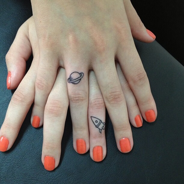 I love these two little tattoos... but NOT on the fingers, not my thing. How cute would it be to get one behind each ear though?