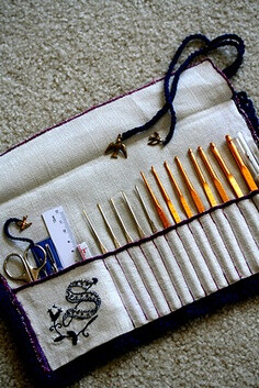 inside handmade crochet needle case with gold bird