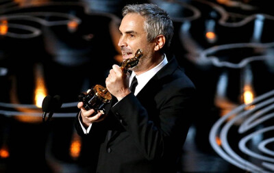 Alfonso Cuaron celebrates winning the directing Oscar for &amp;quot;Gravity.&amp;quot;