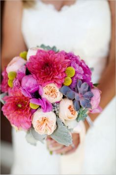 vibrant pink and purple bridal bouquet #bouquet #bride #weddingchicks http://www.weddingchicks.com/2014/02/04/country-fair-wedding/