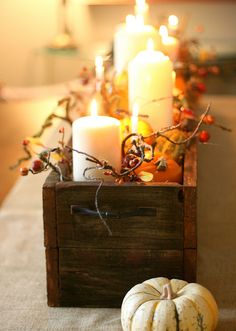 Fall Table Centerpiece - made from old fence boards and filled with candles, pumpkins and gourds.