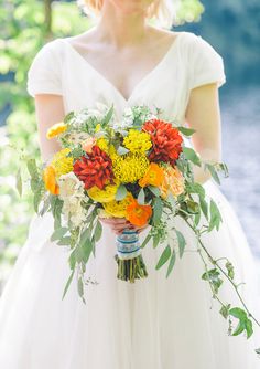 Red and yellow bridal bouquet | photo by aster