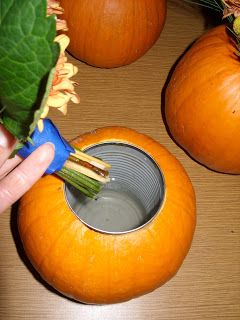 If you're decorating for autumn, use a can inside a pumpkin to put flowers or other decorations in. Brilliant!