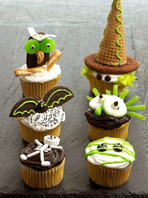 Owl, Witch, Goblin, Mummy, Bat and Skeleton Cupcakes. See how to make these and more Halloween cupcakes: http://www.midwestliving.com/food/holiday/decorate-fun-halloween-cupcakes/