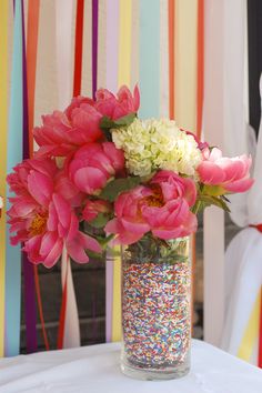 Sprinkles + flowers = classy Use a smaller vase inside to keep water away from sprinkles.