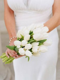 A chic bouquet of #white #tulips. (Photo by Shelly Kroeger) #wedding