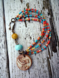 Rustic bird. Cermic beads, ceramic charm. Czech glass seed beads. Mookiate bead. Coral pink, yellow, gold and Turquoise Beads. Vintaj brass.. $32.00, via Etsy.