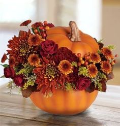 LOVE, LOVE, LOVE THIS!!!!!!! More purples in the flowers? I would love to use pumpkins that don't look like pumpkins!