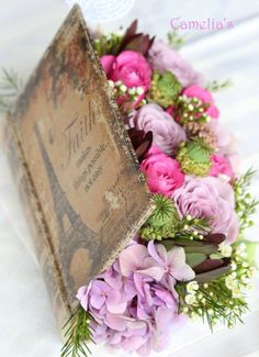 use an old book to make this (take out pages, then line with plastic) Vintage Flower Arrangements You Must Do This Spring