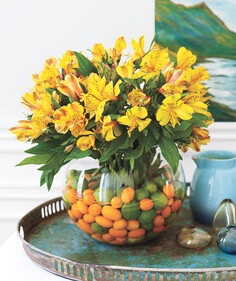 Fruit Fillers This tone-on-tone assemblage starts with miniature citrus fruits (key limes, kumquats) and Peruvian lilies bursting with color.