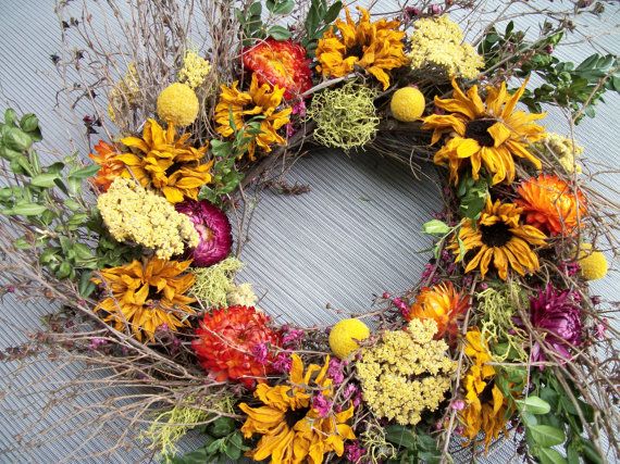 Handmade twig wreath with dried sunflowers, strawflower,yarrow, billy balls and moss, main wreath is 12'' and twigs come out to 16''-18'' wide. Designed by twigs4u