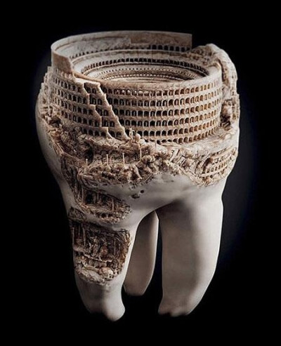 A sculpture of the Roman Colosseum, done in a real tooth.
