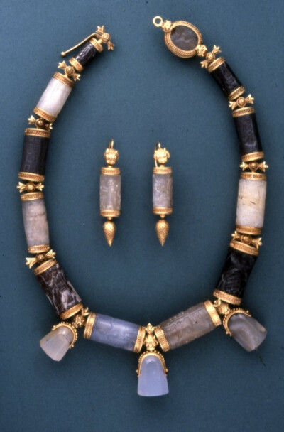 A 19th century jewellery set made from Assyrian and Babylonian cylinder and stamp seals, belonging to Lady Layard. The seals date from anywhere between 2000 and 600 B.C., the gold mounting from the la…