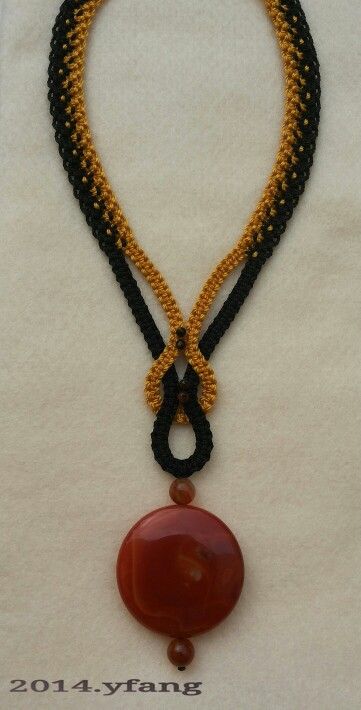 Black and gold macrame necklace with carnelian stones