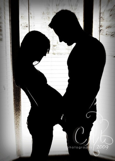 A man and woman. An abstract heart. Reaching out with love. Black and white photo. A silhouette filled with contemplation and reflection. Dreams of the future mingle with the heat of the past. Finding…