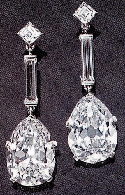 An impressive pair of diamond and platinum drop earrings, Cartier, Paris. Bonhams.