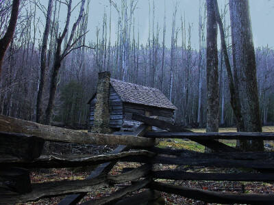 Log cabin and split rail fence on a Drive trail in the Great Smokey Mountains National Park in the Gatlinburg vicinity.