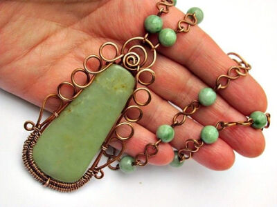 20 Amazing Handmade Jewelry Ideas. I like the figure of 8 on chain as link between beads.