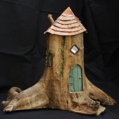 Teeny tiny wooden fairy house