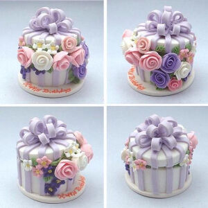 Polymer clay over a wooden or cardboard box form (check Michael's) and decorated something like this would make a great birthday present,