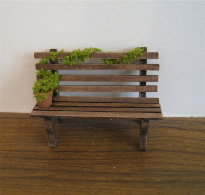 Garden bench, twelfth scale dollhouse miniature. $12.50, via Etsy.