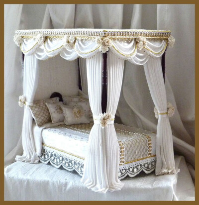 Four poster dollhouse bed.