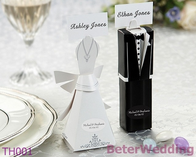 Whimsical but still proudly displaying a dash of formality, these bride and groom favor boxes double as placecard holders and are a charming little touch to any place setting. Choose from the bride or groom. Sold as a set of 12. A wonderful way to present your guests with candies or treats. Boxes sh