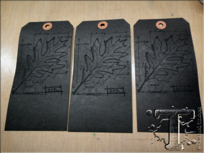 step 7: emboss 3 black tags with the same image using frosted crystal embossing powder.