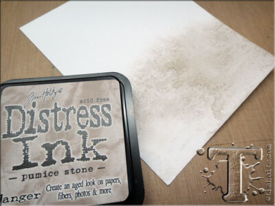 step 21: apply pumice stone distress ink to a piece of card stock, mist with water to blend, and let dry.