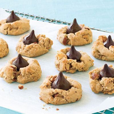 Cappuccino Blossoms These coffee and almond cookies topped with chocolate kisses are easy enough to make that your children can help you prepare them.