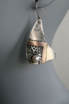 Earrings | Craig Moore. &amp;quot;Tribal&amp;quot; Sterling silver and gold with a white pearl.