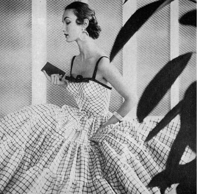 ~1953 Evelyn Tripp in a tiered black and white cotton evening dress with black velvet trim by Jerry Parnis~