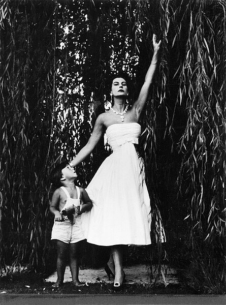 Simonetta, wearing one of her designs, with her son Bardo, 1956