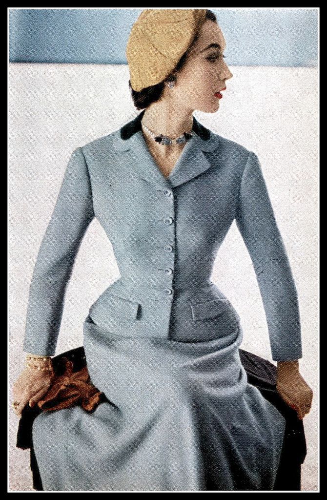 Dovima in blue suit with velvet collar, mustard beret completes the outfit, by Hattie Carnegie, photo by Horst, Vogue, February 1, 1952