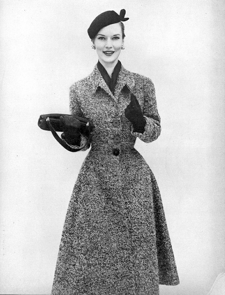 model in tweedy coat with fitted waist and flare
