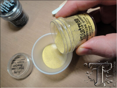 step 37: pour a thin layer of distress embossing powder over the clear utee.