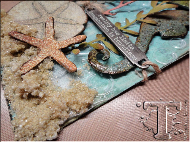 *the details: i just love the finished textured look of this tag between the crackled seahorse, the embossed plastic bubble layer, the paper and grungeboard elements, and of course the “sand”. this technique can be used on a burlap panel, the cover of a mini book, or in a shadowbox or configuration