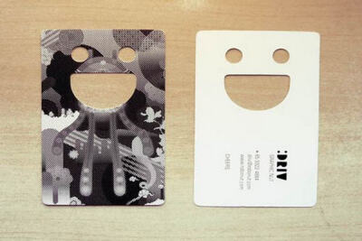 Smiley or emoticon in a die-cut business card