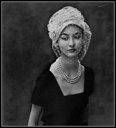 Model in hat by Claude St. Cyr, dress by Jean Dessès, pearl necklace by Sterlé, photo by Georges Saad, 1957