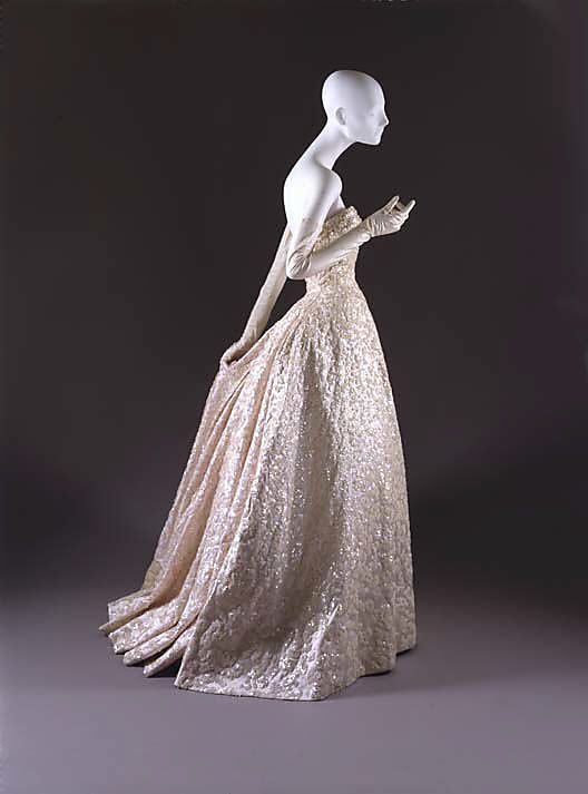 ~Ball gown House of Dior (French, founded 1947) Designer: Christian Dior (French, Granville 1905–1957 Montecatini) Date: fall/winter 1953–54 Culture: French Medium: silk, sequins, stones, simulated pearls~